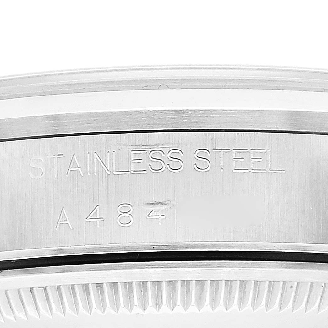 The image shows a close-up of the case back and serial number of a Rolex Date 15200 Men's Stainless Steel Pink Dial 15200 Men's Stainless Steel Pink Dial model watch, highlighting the stainless steel detail.