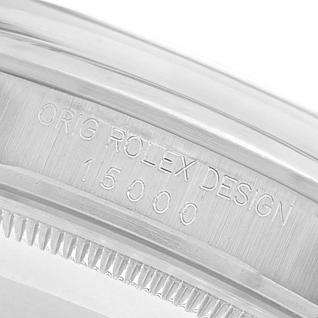 The image shows a close-up view of the case's serial number engraving on a Rolex Date 15000 Men's Stainless Steel Silver Dial 15000 Men's Stainless Steel Silver Dial model watch.