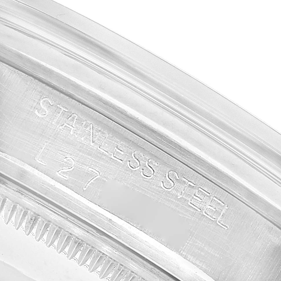 This image shows a close-up of the stainless steel case rim engraving of a Rolex Date 15000 Men's Stainless Steel Silver Dial 15000 Men's Stainless Steel Silver Dial model watch.