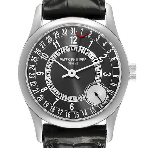 The Patek Philippe Calatrava 6000G-010 Men's White Gold Black Dial watch is shown from a top-down angle, displaying the dial, hands, and date indicator clearly.