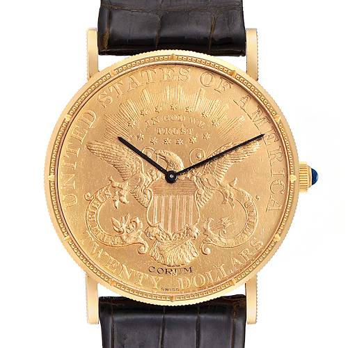 The image shows the face and part of the strap of the Coin Watch model by Corum, featuring a design resembling a gold coin.