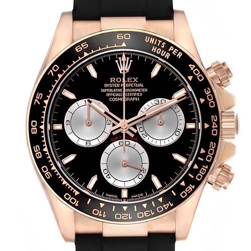 The Rolex Daytona 126515 Men's Rose Gold Black Dial watch is shown from a front angle, displaying the bezel, dial, subdials, and pushers.