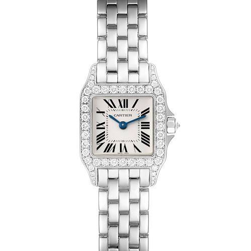 The image shows a frontal view of the Cartier Santos Demoiselle WF9003Y8 Women's White Gold Silver Dial WF9003Y8 Women's White Gold Silver Dial watch, highlighting its square face, Roman numerals, blue hands, diamond bezel, and metal bracelet.