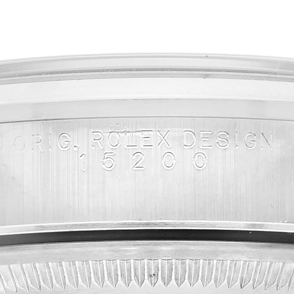 This close-up image shows the side engraving and bezel of a Rolex Date 15200 Men's Stainless Steel White Dial 15200 Men's Stainless Steel White Dial model, specifically the 15200 Design.