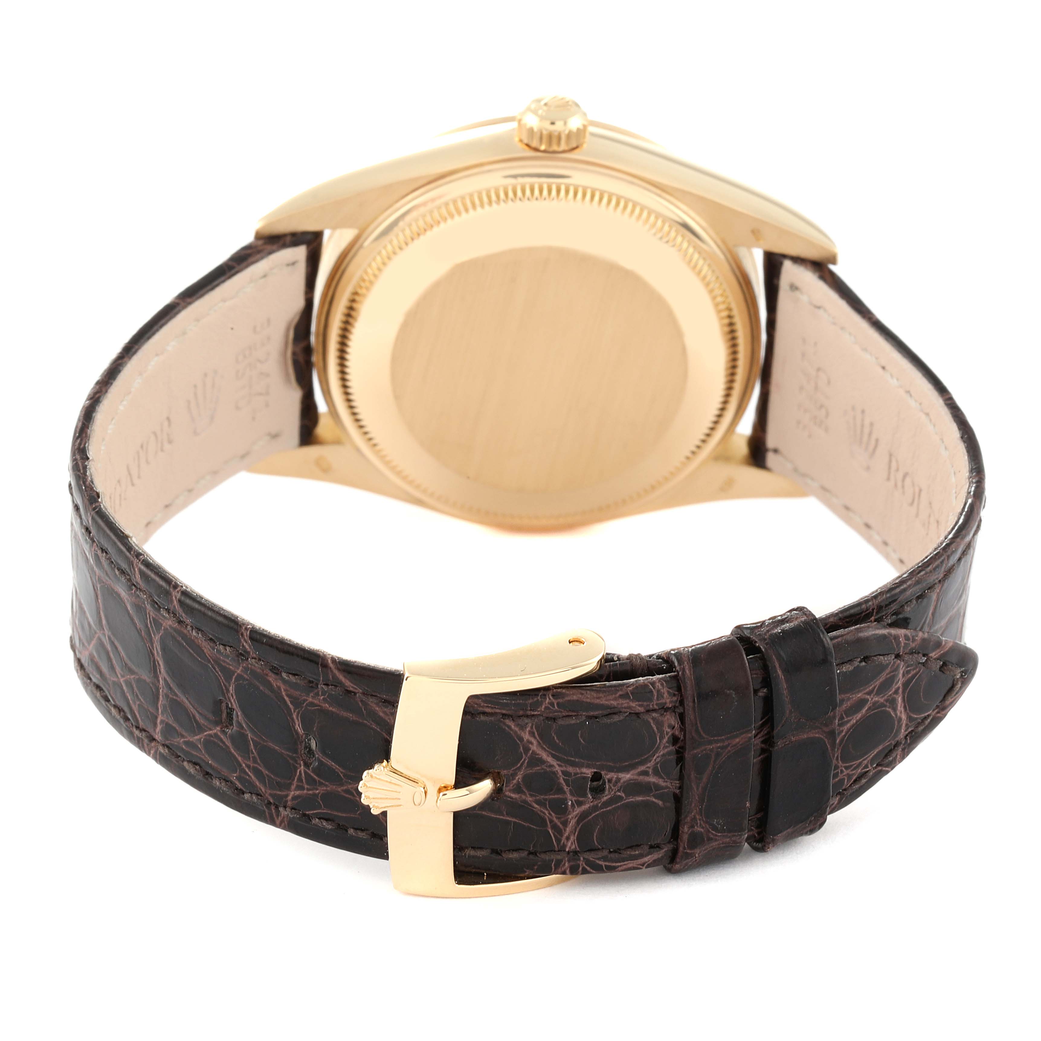 The image shows the back view of the Rolex Date 15238 Men's Yellow Gold White Dial 15238 Men's Yellow Gold White Dial watch, highlighting the case, crown, and leather strap with a gold buckle.