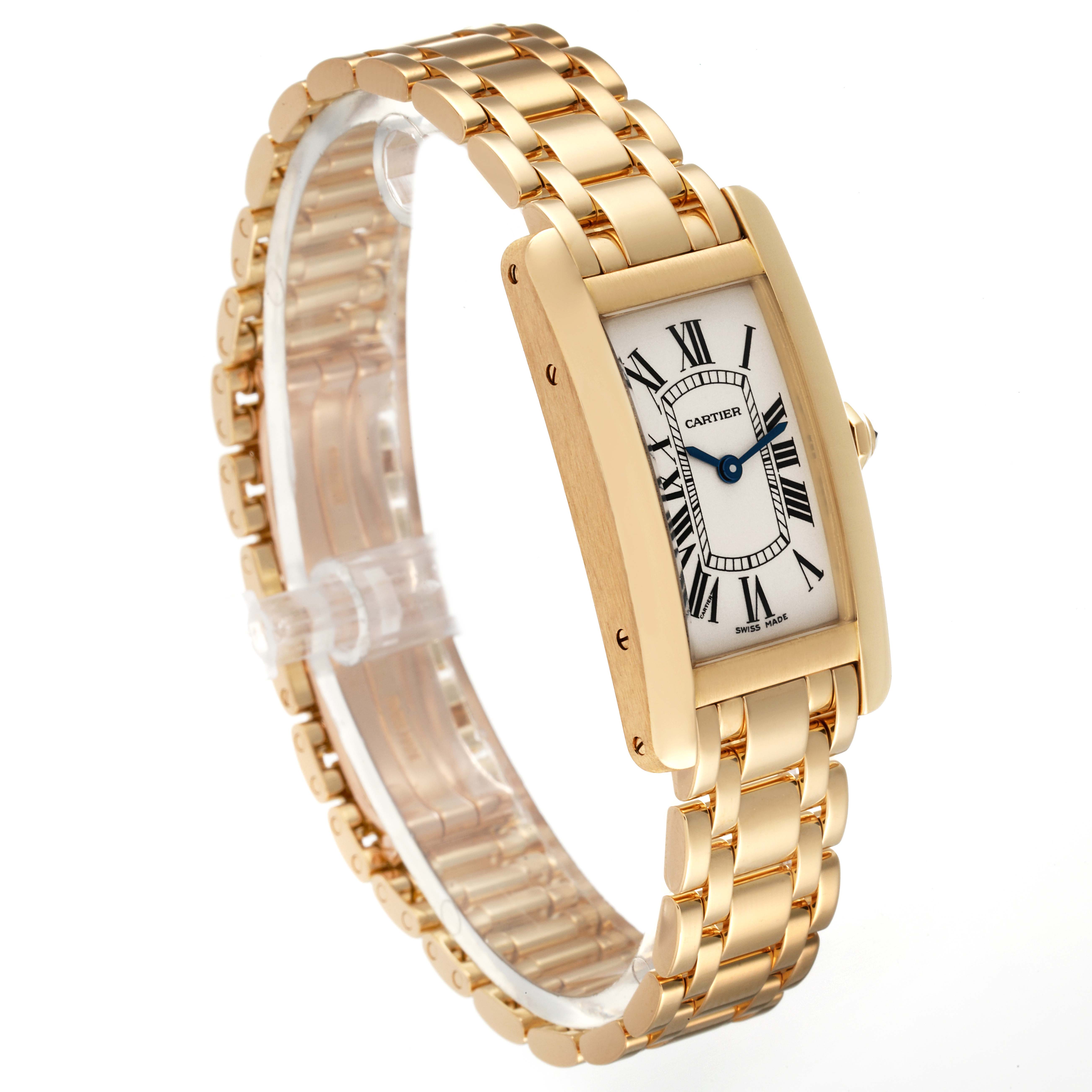 The image shows a Cartier Tank Americaine W26015K2 Women's Yellow Gold Silver Dial W26015K2 Women's Yellow Gold Silver Dial model watch at a slightly tilted angle, highlighting its face and gold bracelet.