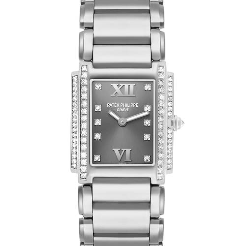 The Patek Philippe Twenty-4 4910/20G-001 Women's White Gold Silver Dial watch is shown from a top-down angle, highlighting its diamond-accented bezel, dial, and bracelet.