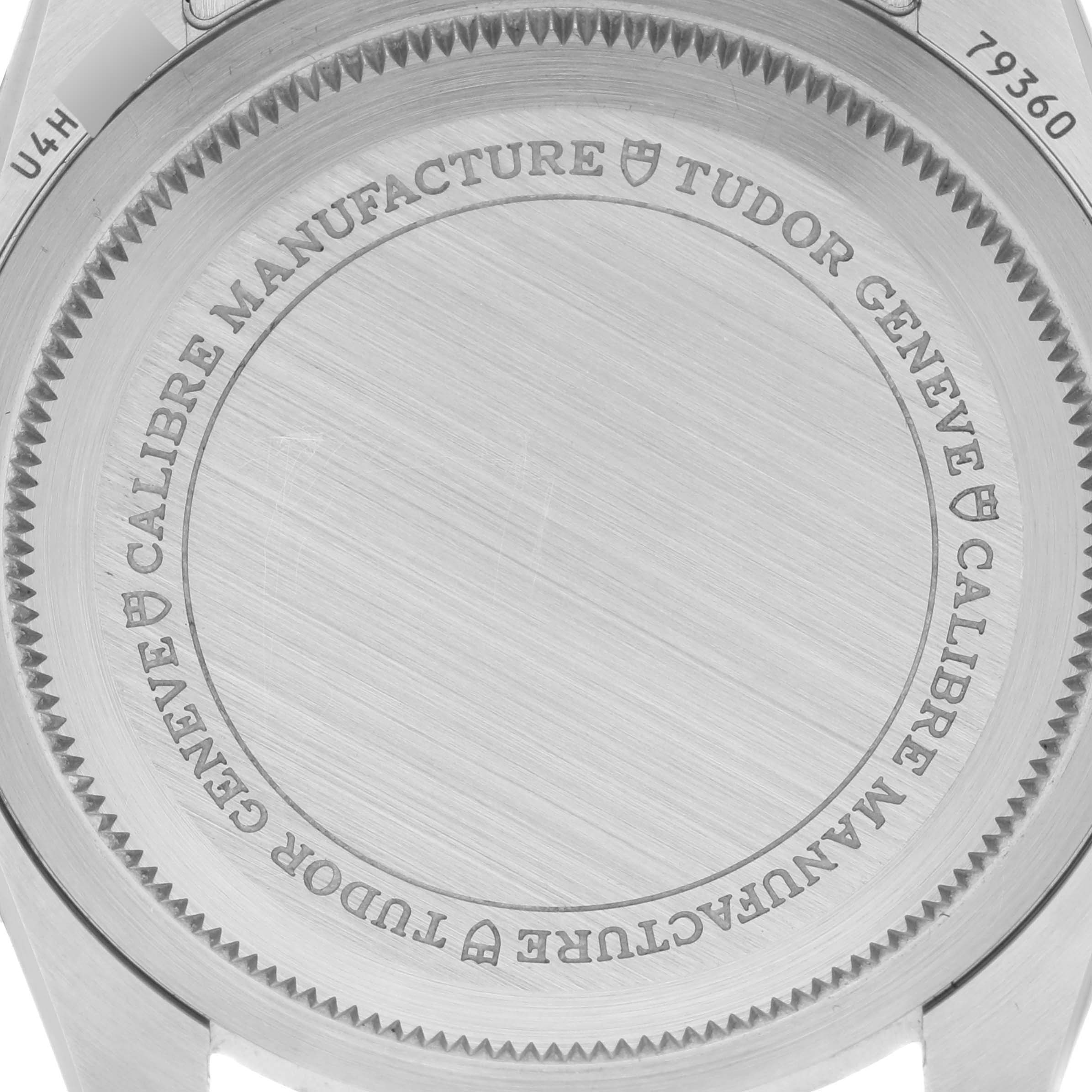 The image shows the engraved back case of the Tudor Heritage Chrono 79360N-0001 Men's Stainless Steel Black Dial 79360N-0001 Men's Stainless Steel Black Dial watch.