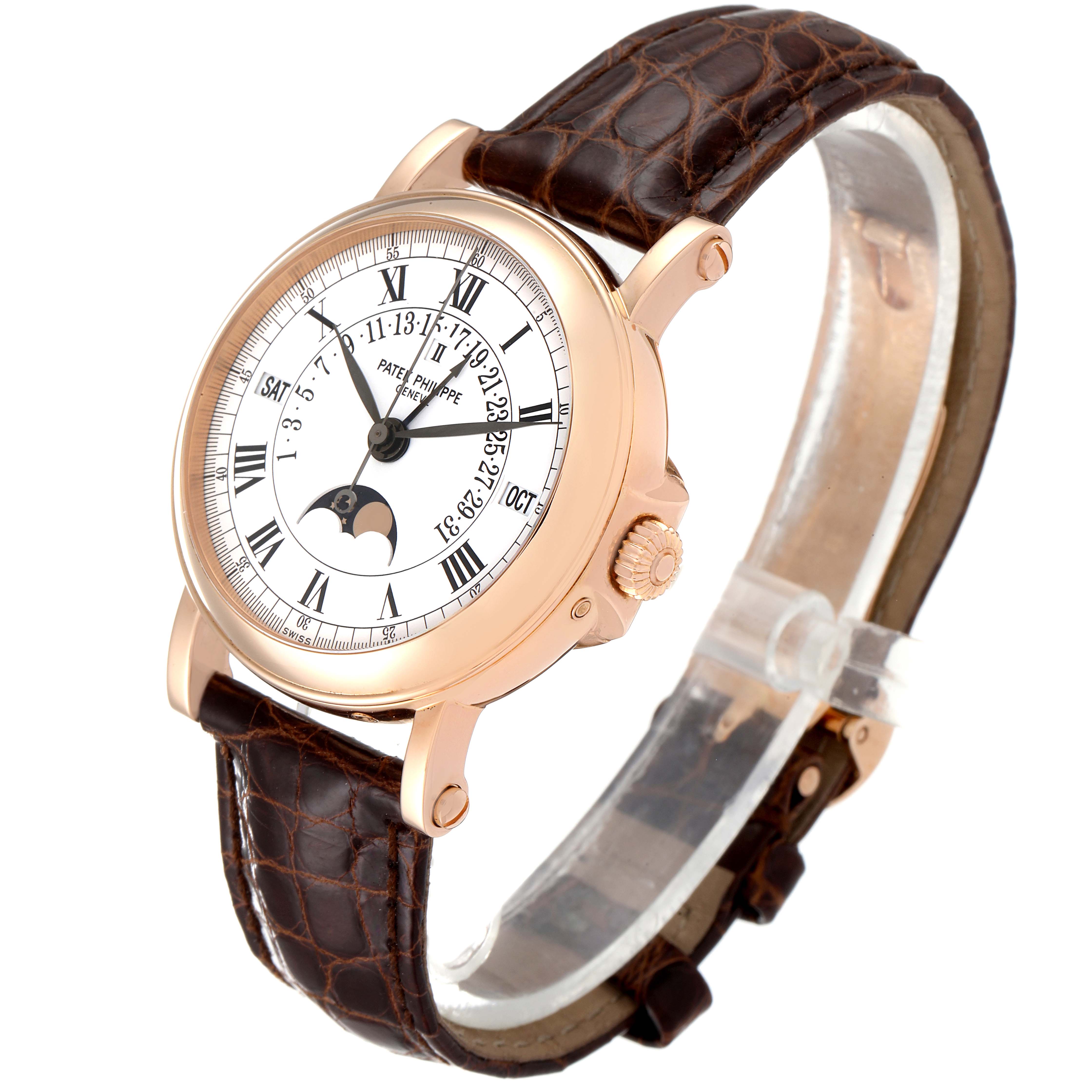 The Patek Philippe Complications 5059R Men's Rose Gold White Dial 5059R Men's Rose Gold White Dial watch is shown at an angled side view, featuring the dial, crown, and leather strap.