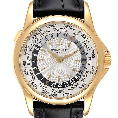 The image shows a front view of the Patek Philippe Complications 5110J Men's Yellow Gold Silver Dial 5110J Men's Yellow Gold Silver Dial watch, focusing on its world time dial and gold case.
