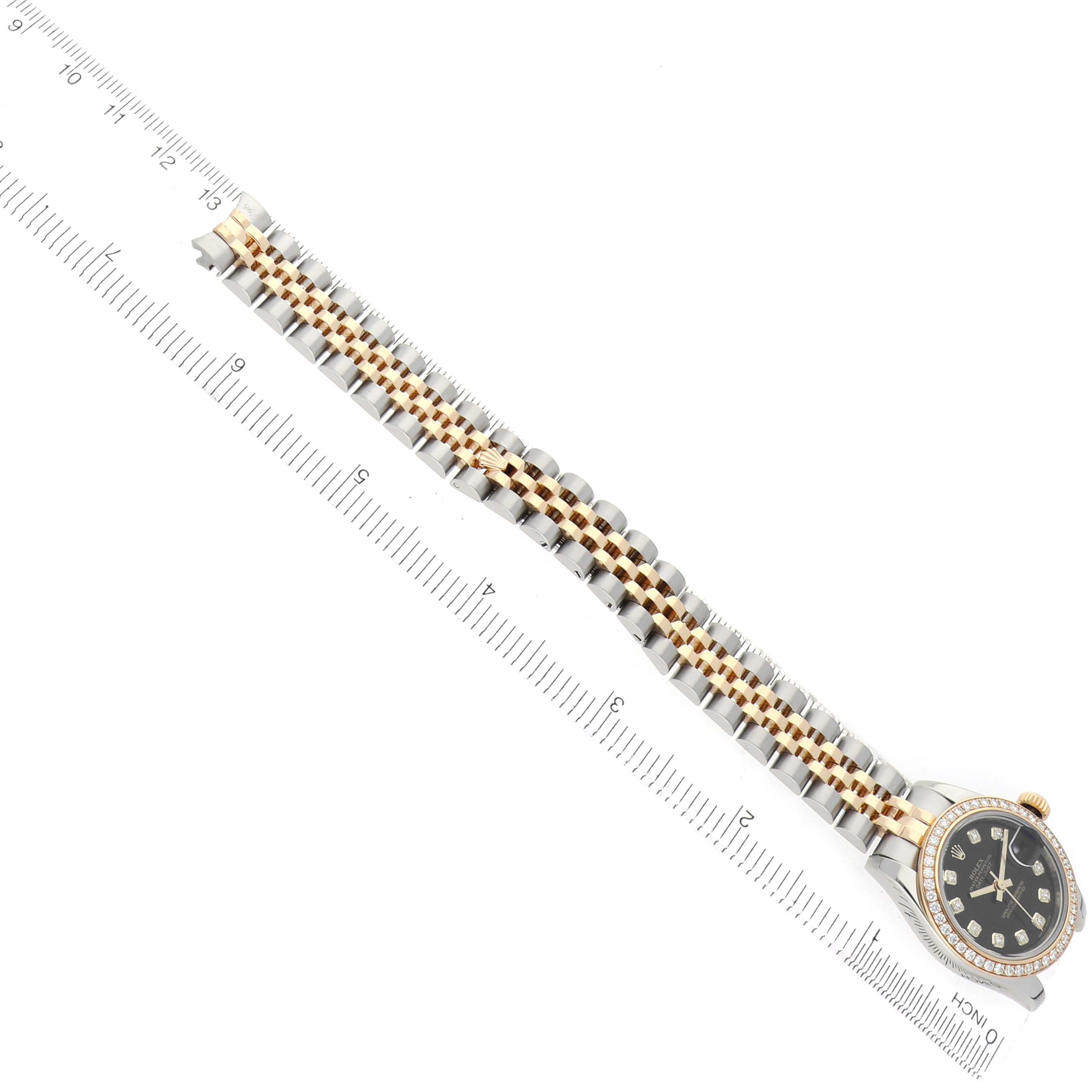 The Rolex Datejust 179383 Women's Steel and Gold (two tone) Black Dial watch is shown from a top view, featuring the bracelet and partial view of the watch face and bezel.