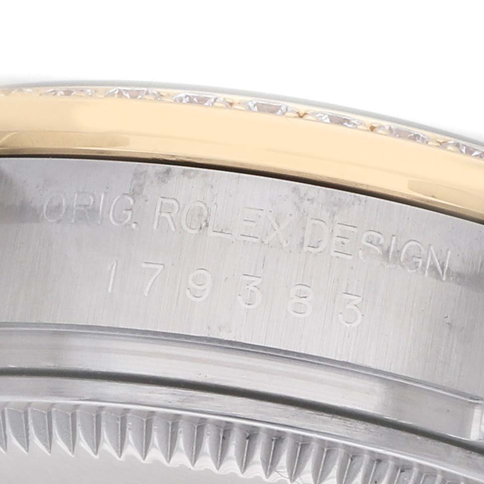 This image shows a close-up of the side of a Rolex Datejust 179383 Women's Steel and Gold (two tone) Black Dial watch, highlighting the engraved model and bezel detail.