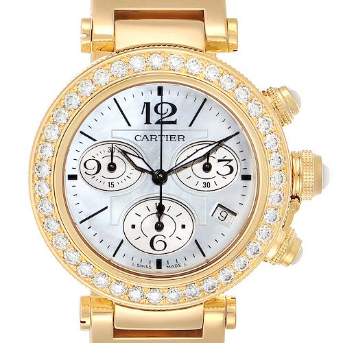 The Cartier Pasha WJ130007 Women's Yellow Gold Mother of Pearl Dial WJ130007 Women's Yellow Gold Mother of Pearl Dial watch is shown from the front, displaying its dial, bezel with diamonds, and parts of the bracelet.