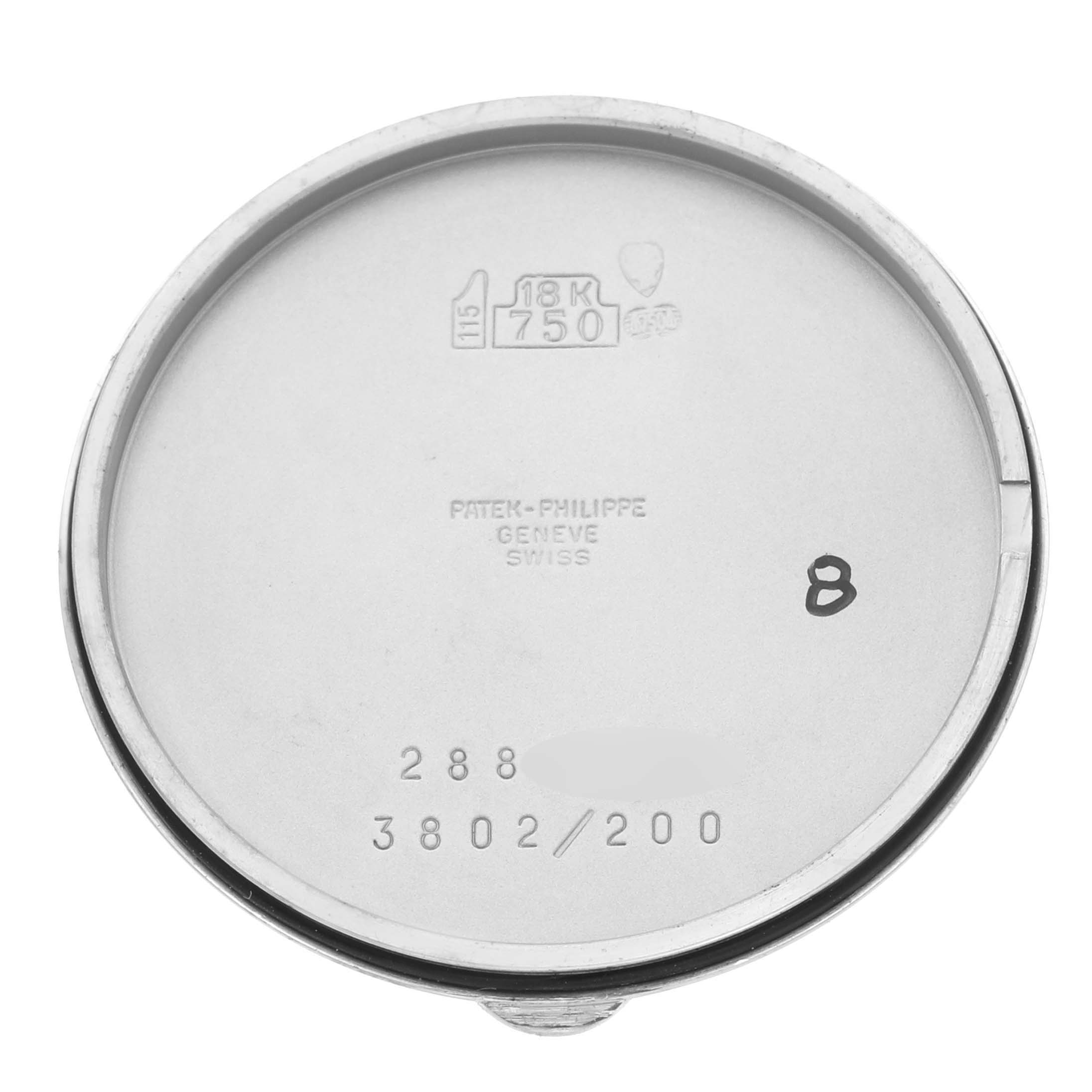 The image shows the inner side of the Patek Philippe Calatrava 3802/200G-001 Men's White Gold White Dial 3802/200G-001 Men's White Gold White Dial watch case back with engravings and hallmarks.