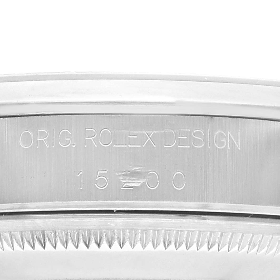 This close-up shows the engraved serial and model information on the side of a Rolex Date 15200 Men's Stainless Steel Blue Dial 15200 Men's Stainless Steel Blue Dial watch.