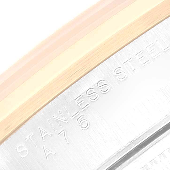 This close-up image shows the side of a Rolex Date 15203 Men's Steel and Gold (two tone) Silver Dial 15203 Men's Steel and Gold (two tone) Silver Dial watch case with stainless steel and gold elements visible.