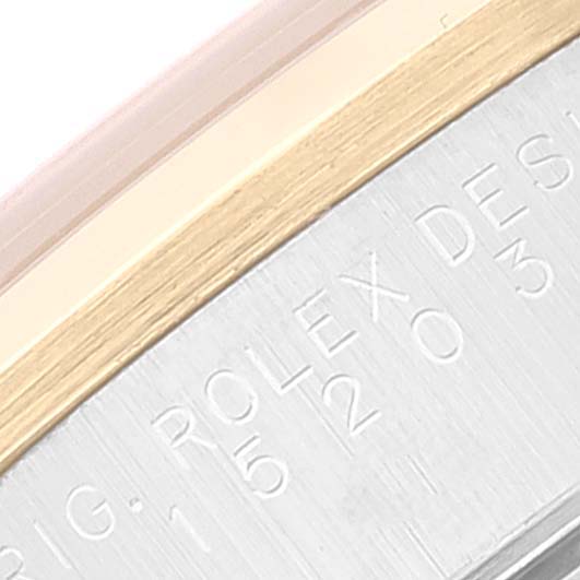 The image shows a close-up of the case edge on a Rolex Date 15203 Men's Steel and Gold (two tone) Silver Dial 15203 Men's Steel and Gold (two tone) Silver Dial model, displaying the engraved brand markings.