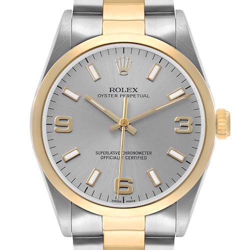 The Rolex Oyster Perpetual 14203 Men's Steel and Gold (two tone) Silver Dial watch is shown from a front angle, displaying its face, crown, and part of the bracelet.