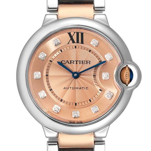 This image shows a close-up, front view of the Cartier Ballon Bleu WE902054 Women's Steel and Gold (two tone) Pink Dial WE902054 Women's Steel and Gold (two tone) Pink Dial watch, highlighting the dial, hands, and part of the bracelet.