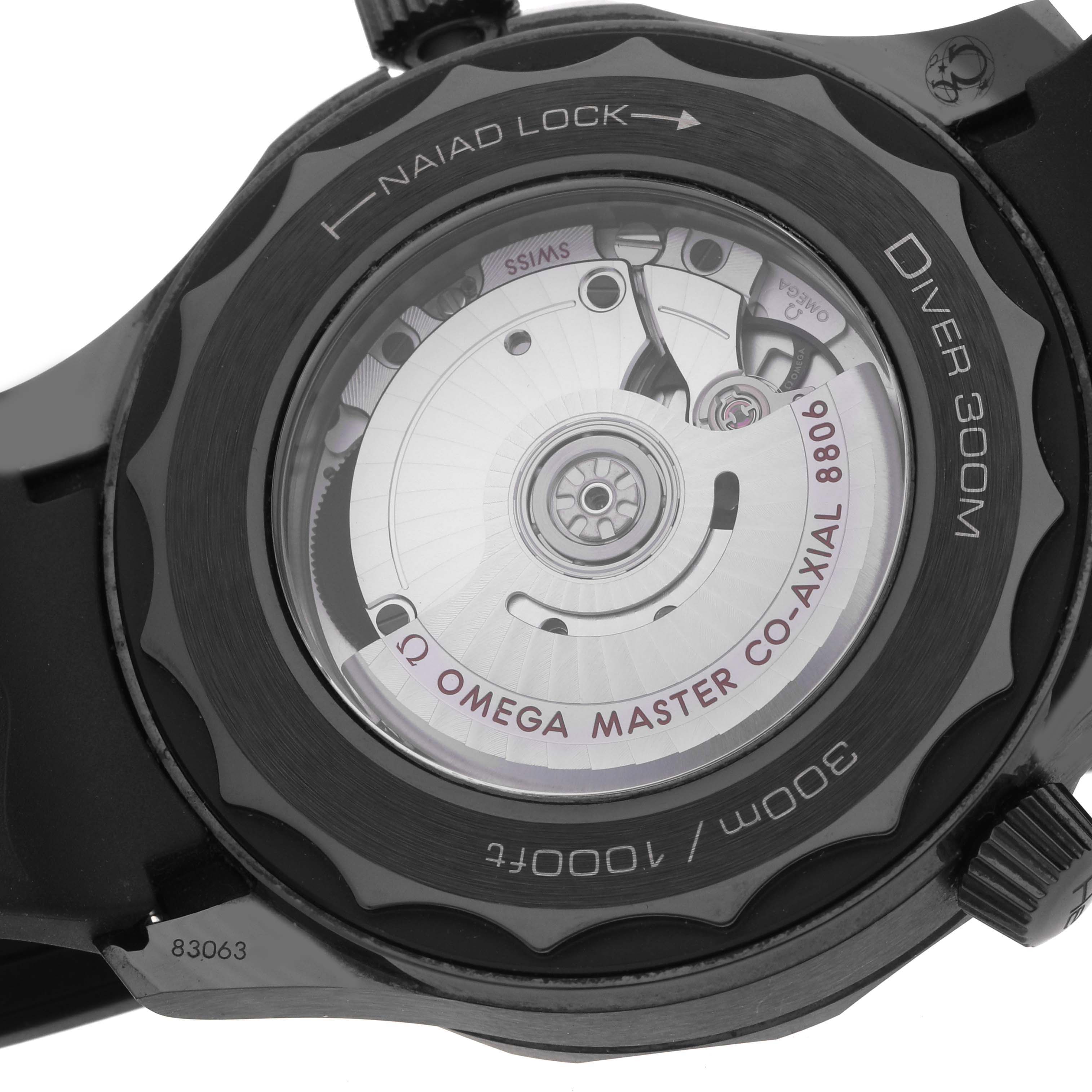 The image shows the back view of the Omega Seamaster 210.92.44.20.01.003 Men's Ceramic Black Dial watch, displaying its movement and "Diver 300M" markings.