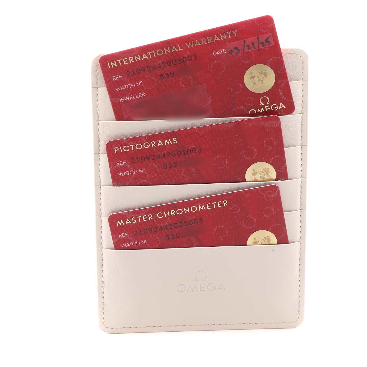 The image shows an Omega cardholder with three cards for the Seamaster model, including warranty and certification details.