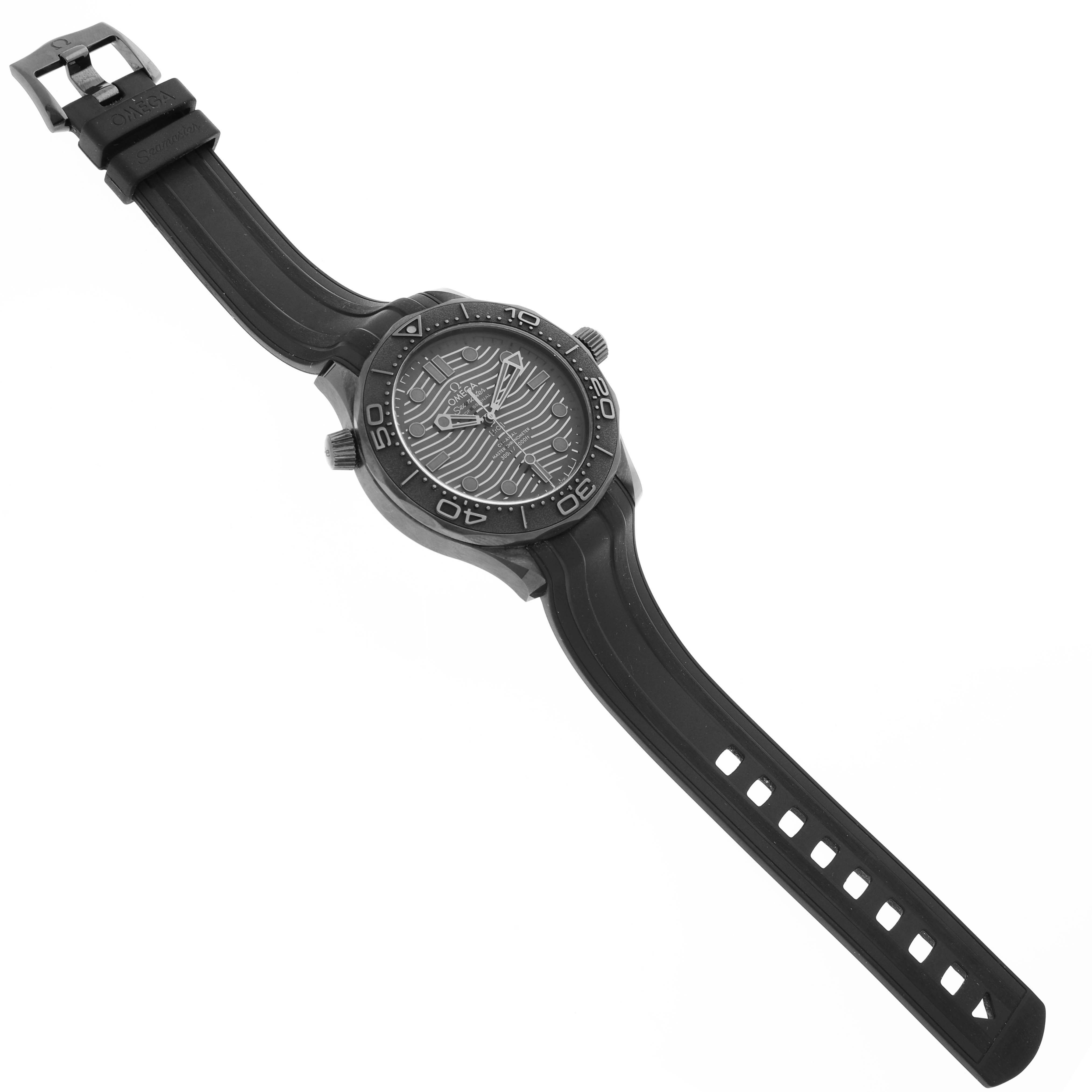 The Omega Seamaster 210.92.44.20.01.003 Men's Ceramic Black Dial watch is shown at a tilted angle, displaying the face, case, bezel, strap, and buckle.