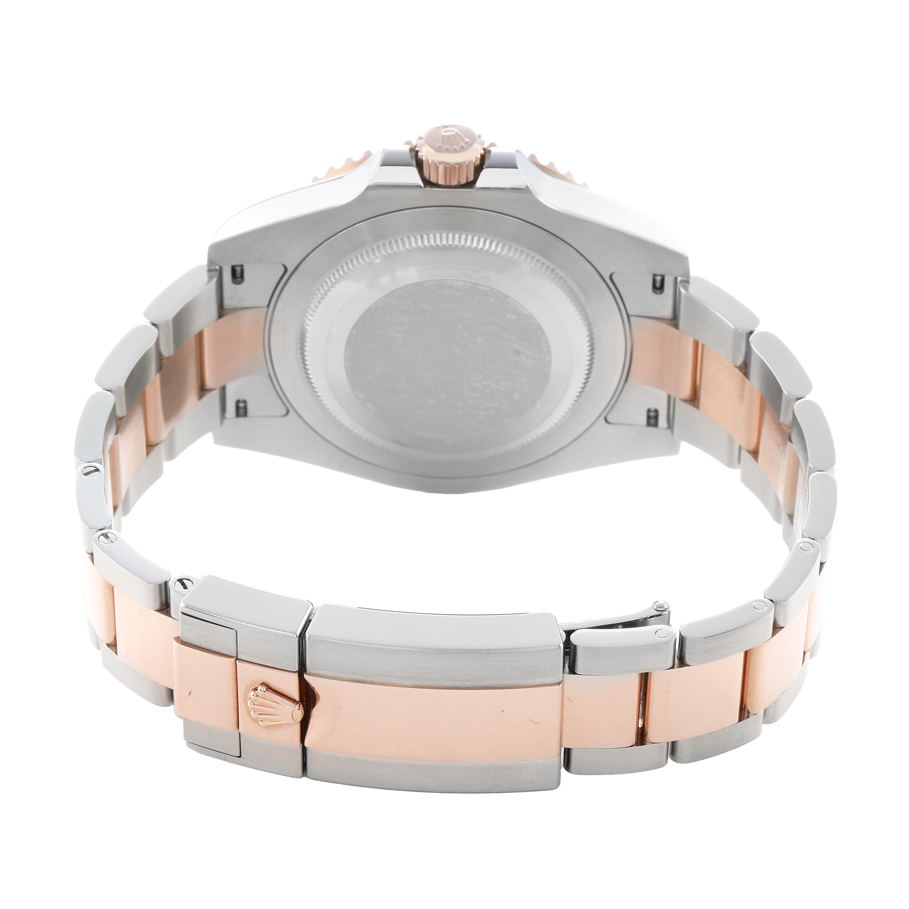 The Rolex GMT-Master 126711 Men's Steel and Gold (two tone) Black Dial is shown from the back, highlighting the case back, crown, and metal bracelet with a clasp.