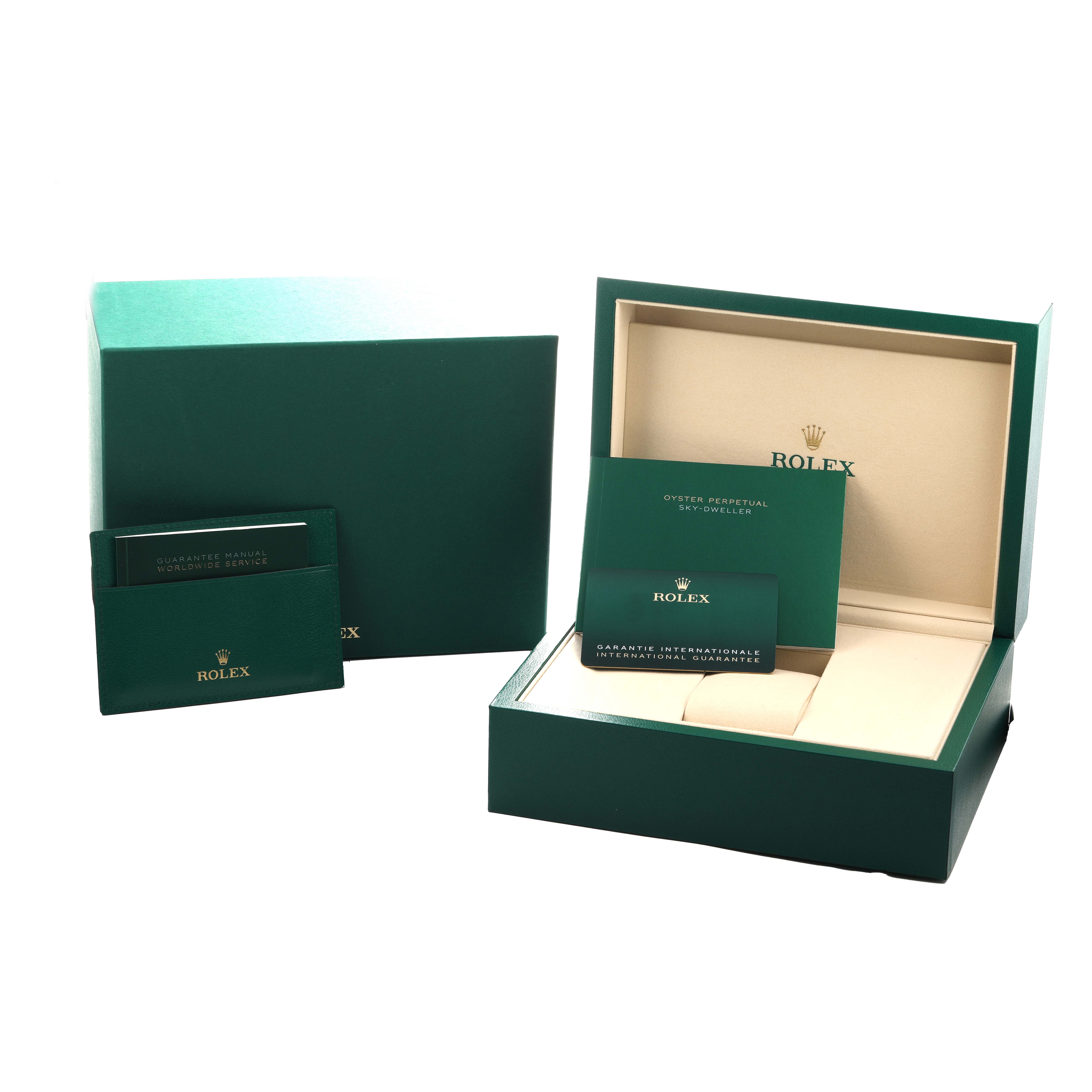 The image shows packaging and accessories for a Rolex GMT-Master 126711 Men's Steel and Gold (two tone) Black Dial, including boxes and documentation from a front angle.