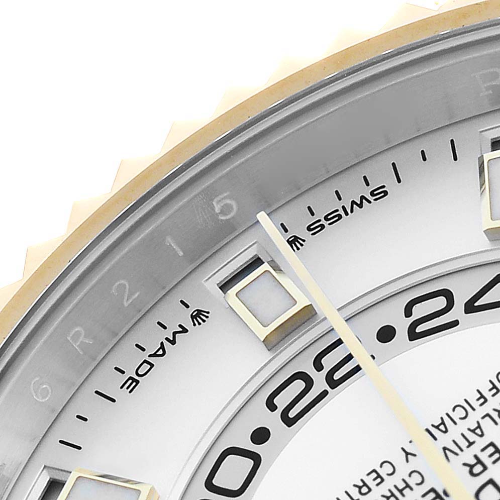 The image shows a close-up of the Rolex Sky-Dweller 336933 Men's Steel and Gold (two tone) Silver Dial's watch face, highlighting the bezel, hour markers, and date indicator.