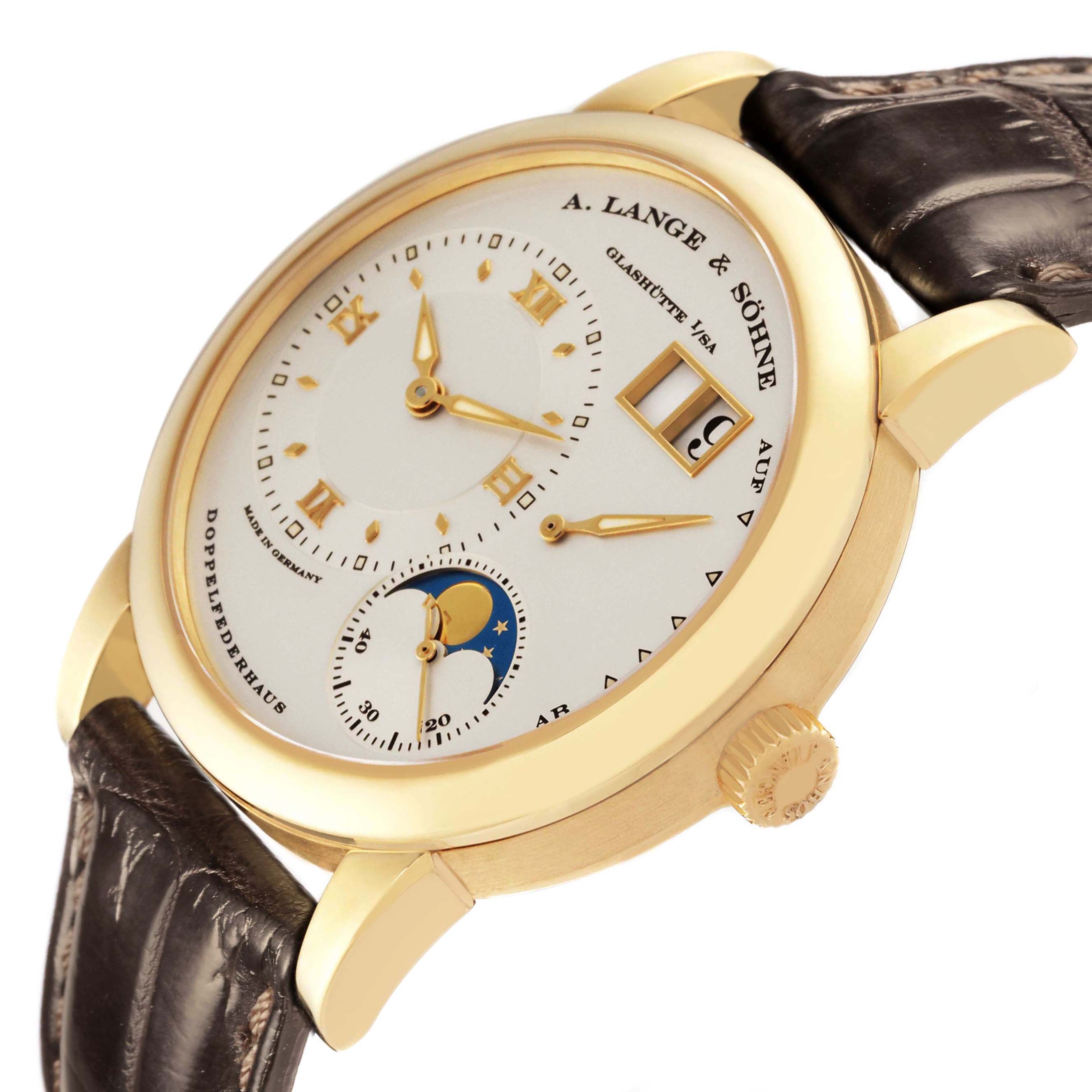 The A. Lange & Sohne Lange 1 109.021 Men's Yellow Gold Silver Dial watch is shown from an angled close-up, highlighting the dial, moon phase, and crown.