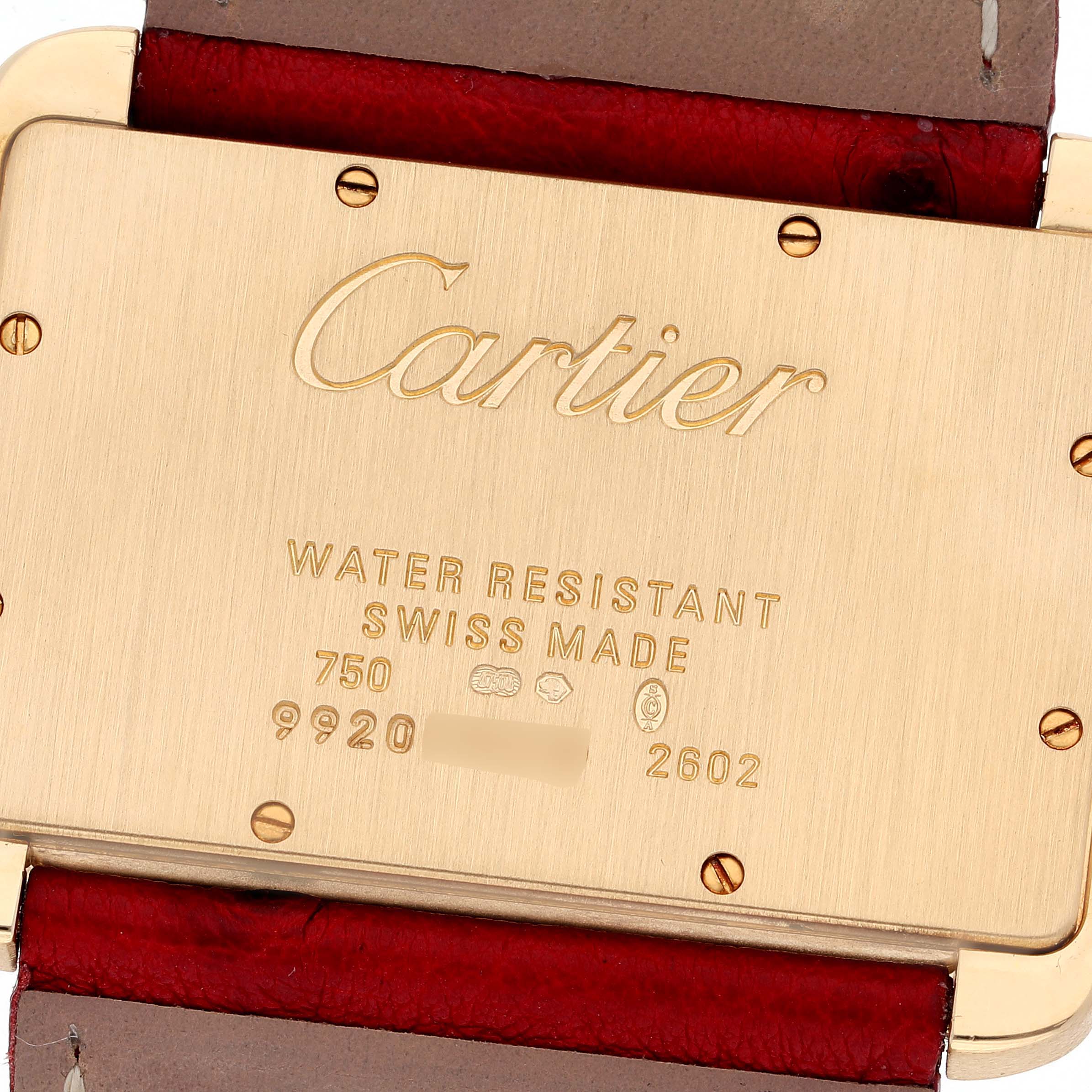 This image shows the back case of a Cartier Tank Divan W6300556‏ Women's Yellow Gold Silver Dial W6300556‏ Women's Yellow Gold Silver Dial watch, highlighting its branding and inscriptions.