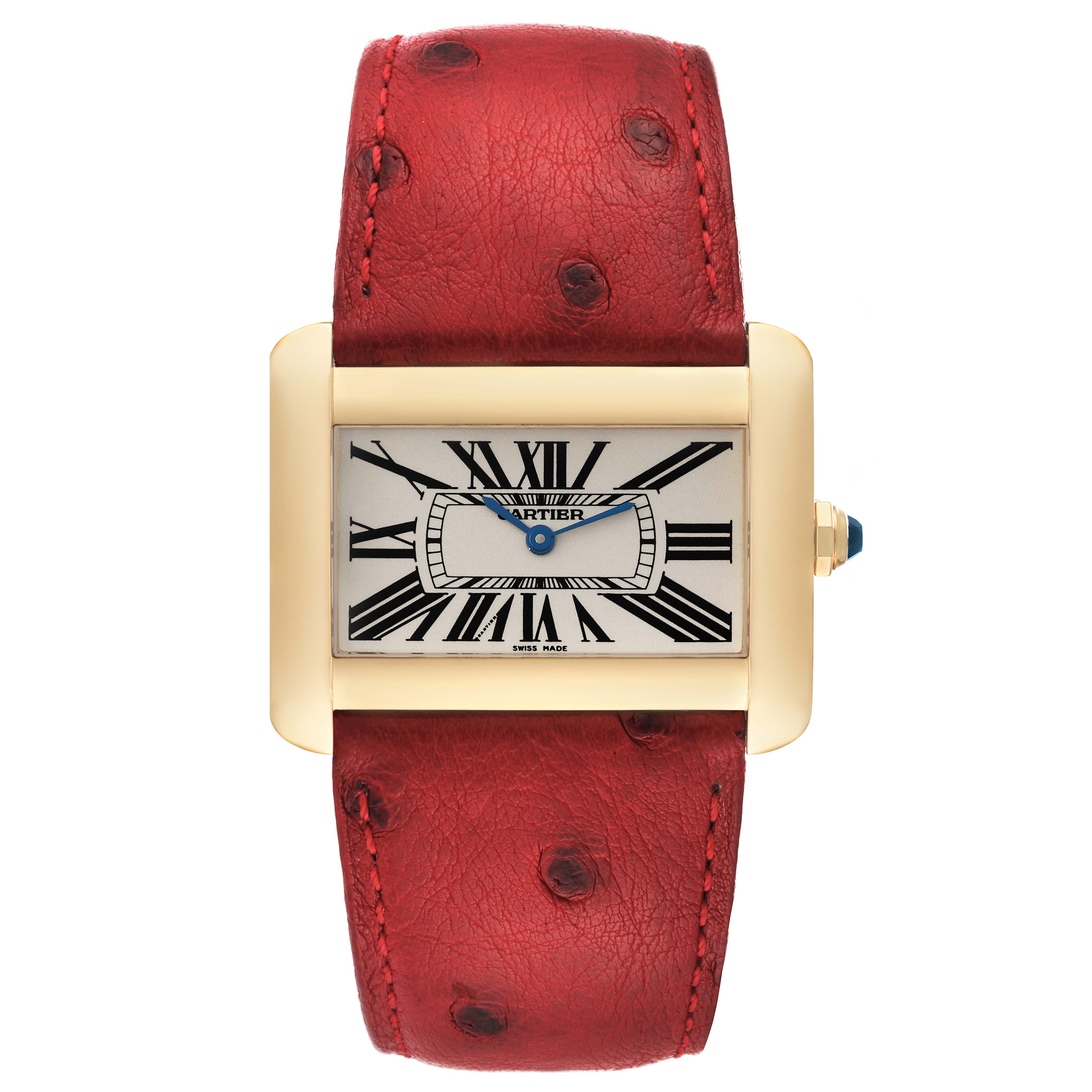 The image shows a front view of the Cartier Tank Divan W6300556‏ Women's Yellow Gold Silver Dial W6300556‏ Women's Yellow Gold Silver Dial watch featuring a red ostrich leather strap and rectangular face with Roman numerals.