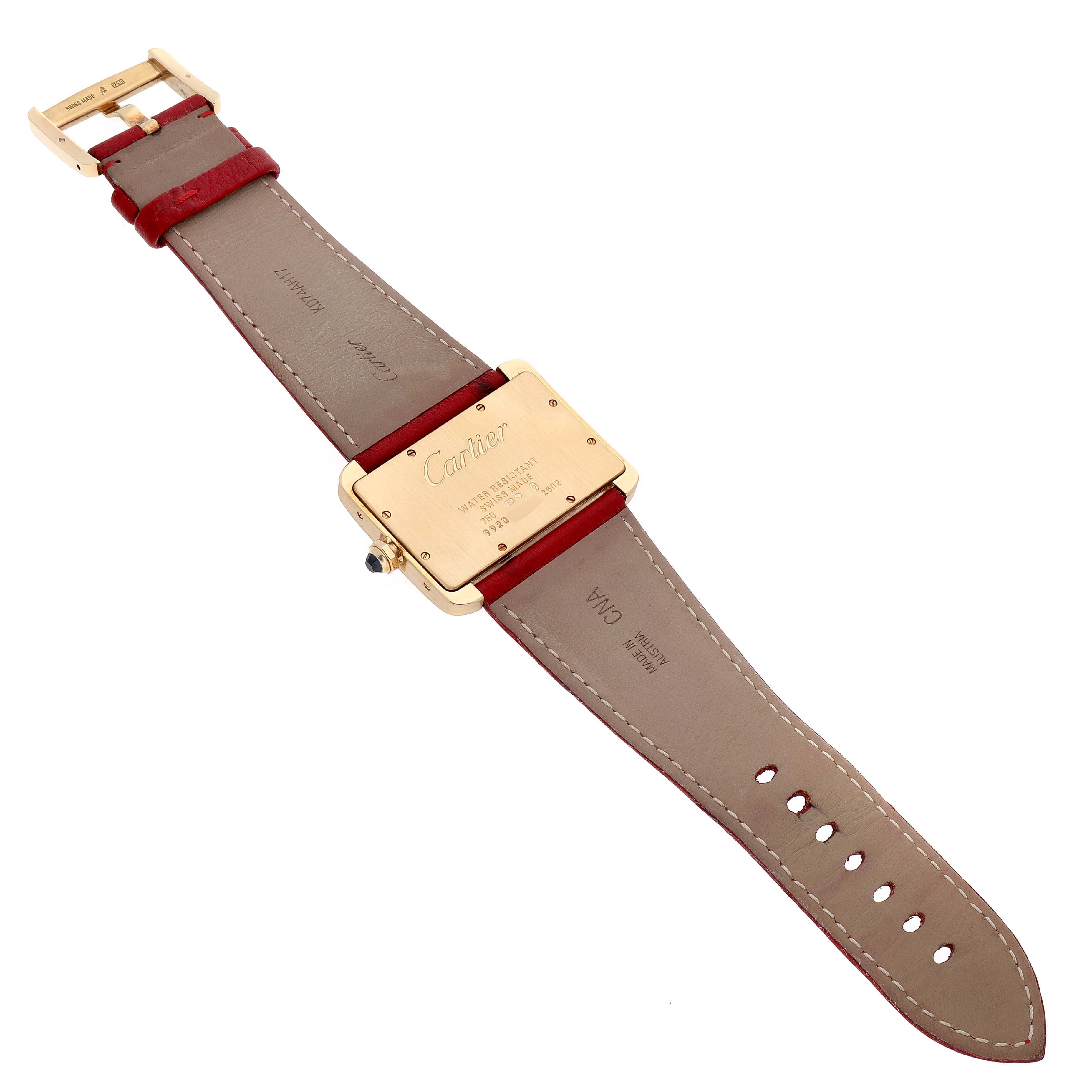 This image shows the back and strap of a Cartier Tank Divan W6300556‏ Women's Yellow Gold Silver Dial W6300556‏ Women's Yellow Gold Silver Dial watch, displaying the leather band and engraved case back.