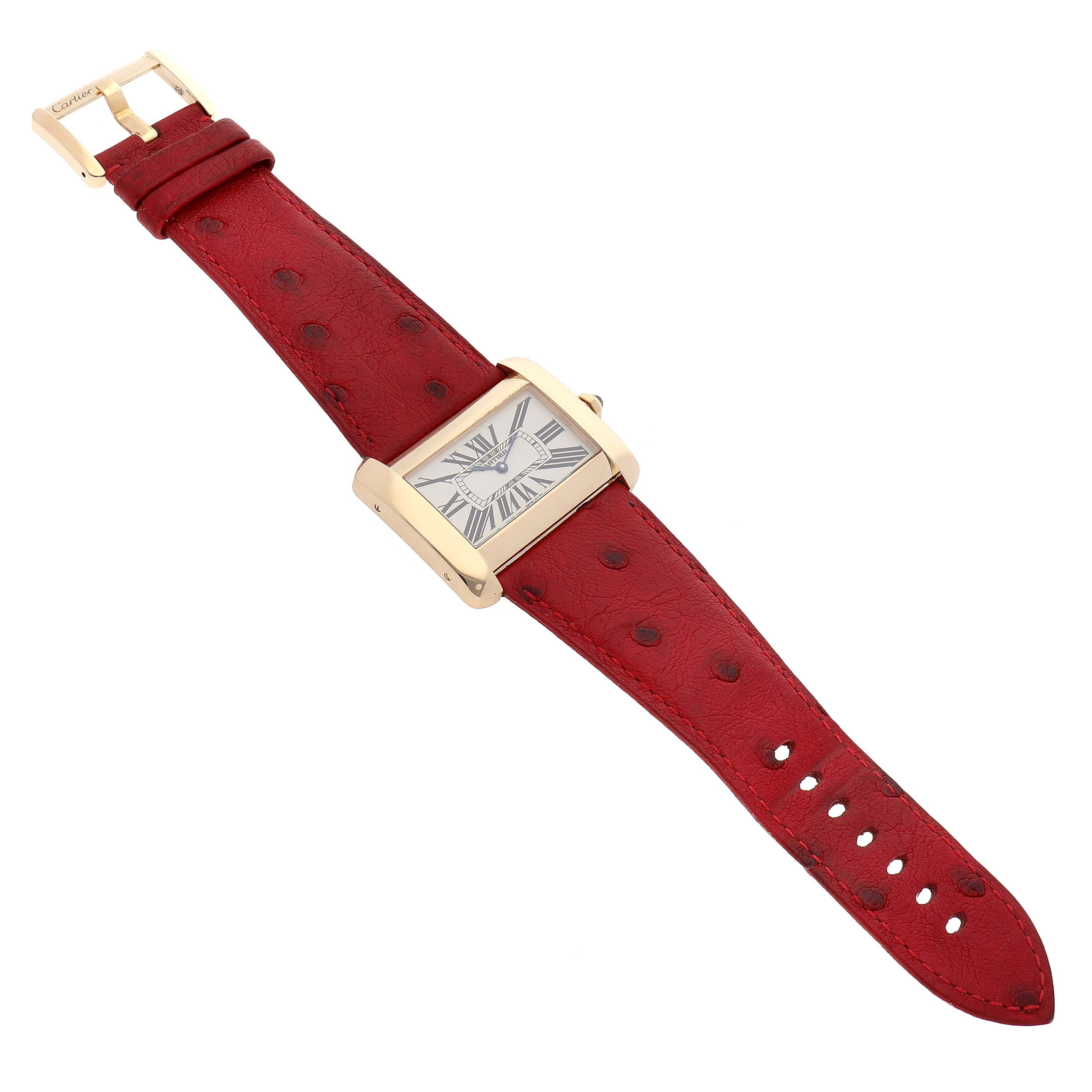 The image shows a Cartier Tank Divan W6300556‏ Women's Yellow Gold Silver Dial W6300556‏ Women's Yellow Gold Silver Dial watch, viewed from a top-down angle, displaying the face, case, red leather strap, and buckle.