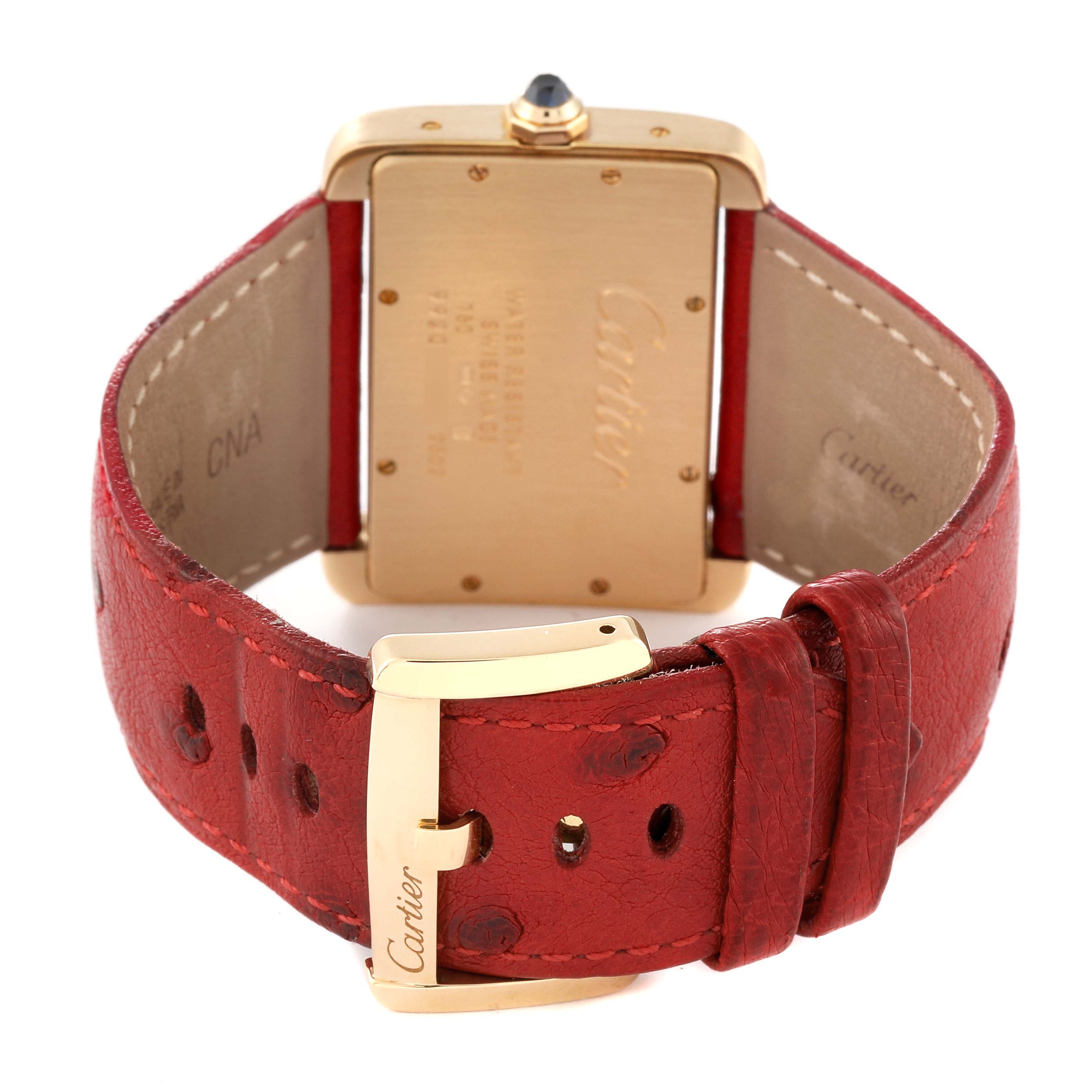 The image shows the back view of the Cartier Tank Divan W6300556‏ Women's Yellow Gold Silver Dial W6300556‏ Women's Yellow Gold Silver Dial watch, focusing on the case back and the red leather strap with a Cartier-marked buckle.