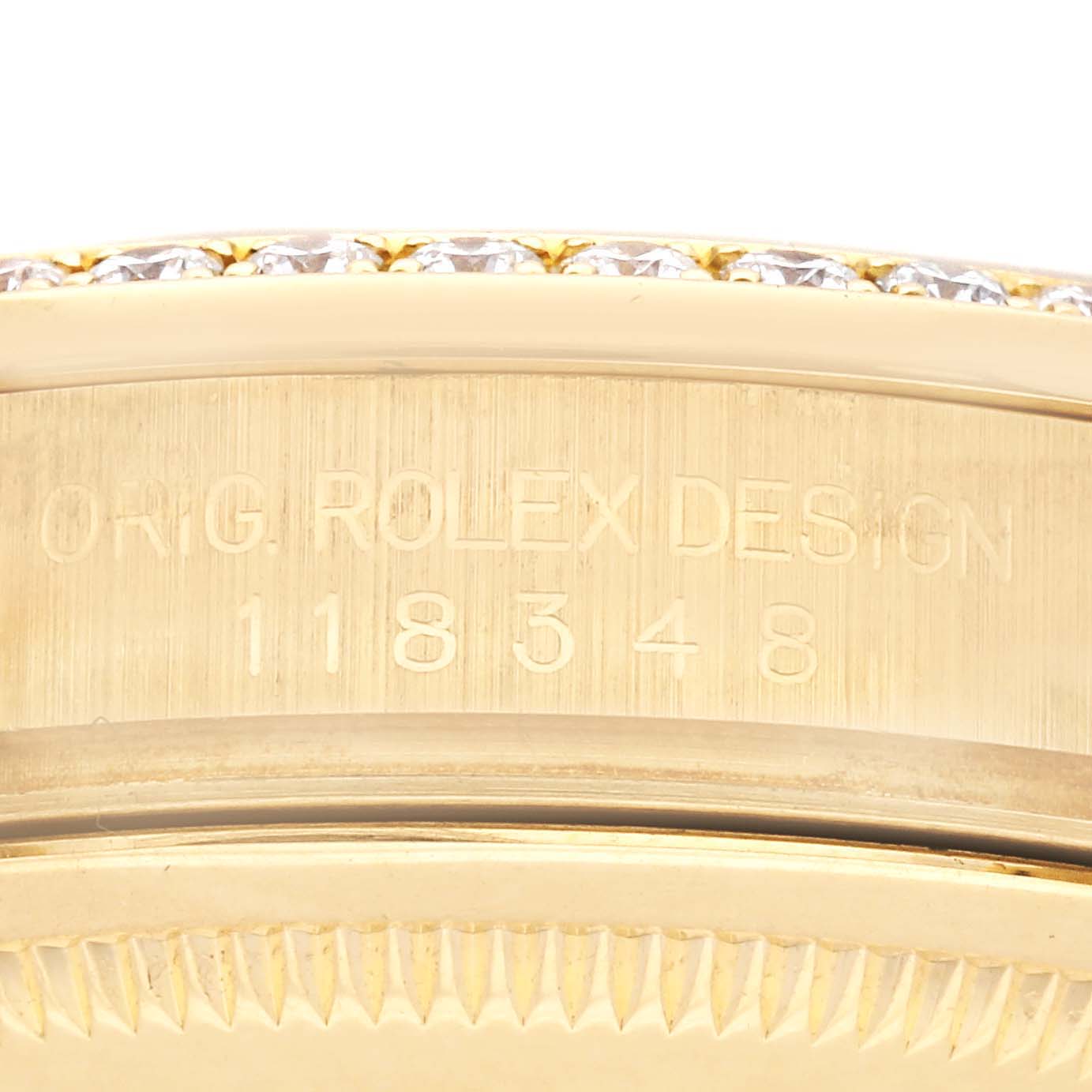 The image shows a close-up side view of the Rolex President 118348 Men's Yellow Gold Mother of Pearl Dial 118348 Men's Yellow Gold Mother of Pearl Dial model, focusing on the engraved case and bezel with diamonds.