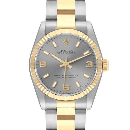The Rolex Oyster Perpetual 67513 Women's Steel and Gold (two tone) Silver Dial watch is shown from the front, displaying its dial, bezel, and part of the bracelet.
