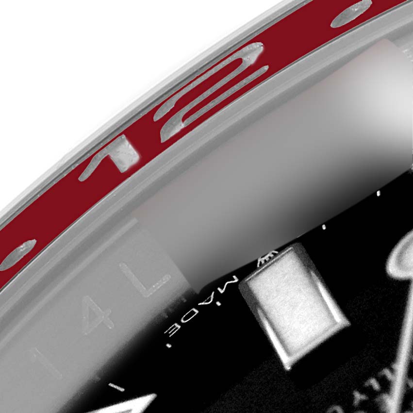 The image shows a close-up of the Rolex GMT-Master 126710 Men's Stainless Steel Black Dial 126710 Men's Stainless Steel Black Dial bezel and partial dial.