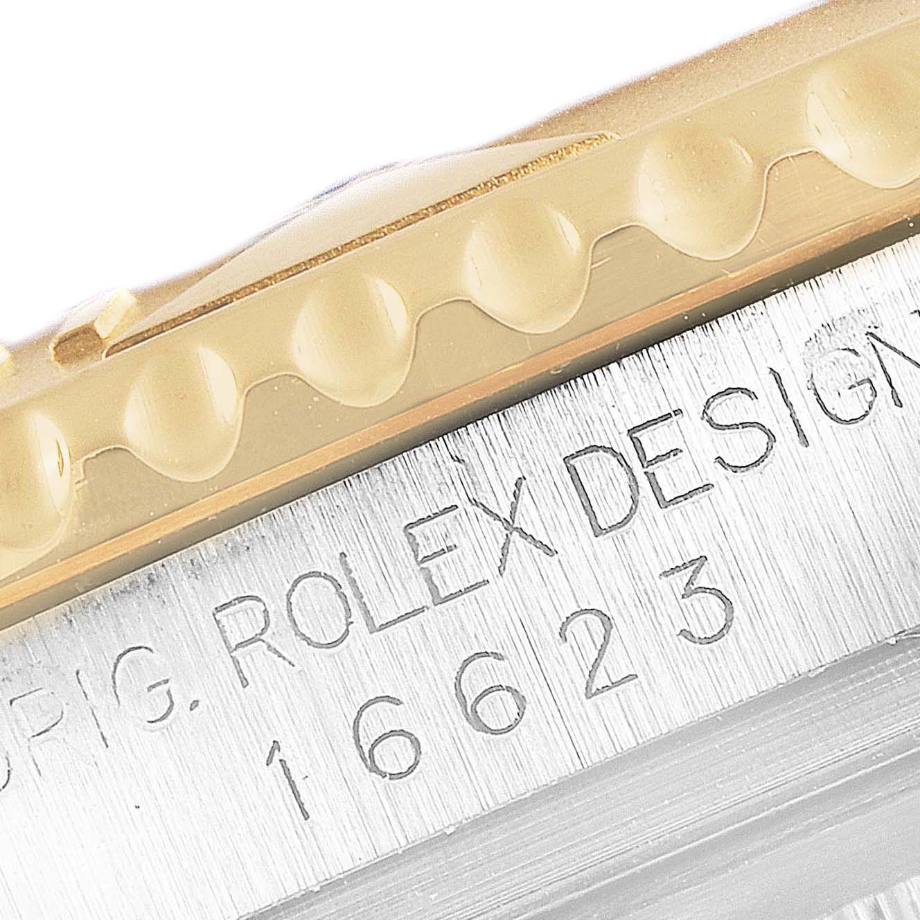 This image shows the edge of the bezel and the engraved model number of a Rolex Yacht-Master 16623 Men's Steel and Gold (two tone) Blue Dial 16623 Men's Steel and Gold (two tone) Blue Dial watch.