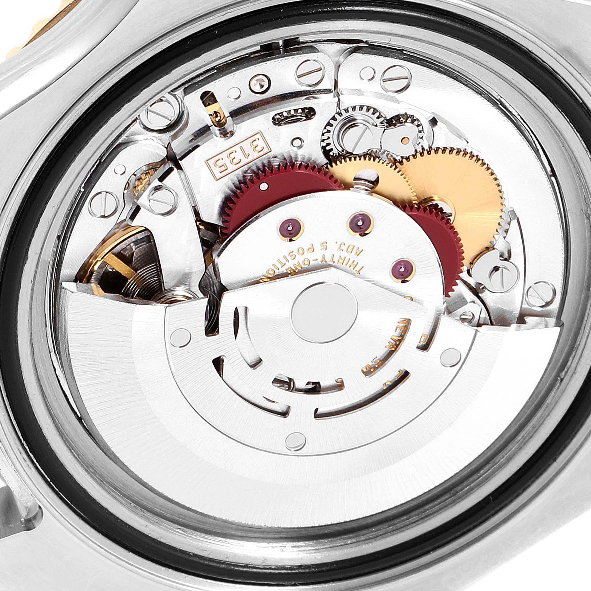 This image shows the internal mechanical movement of the Rolex Yacht-Master 16623 Men's Steel and Gold (two tone) Blue Dial 16623 Men's Steel and Gold (two tone) Blue Dial watch from a close-up, case-back removed view.