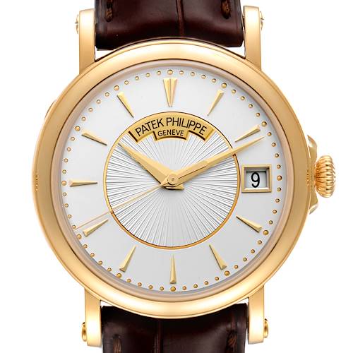 This is a front-angle view of the Patek Philippe Calatrava 5153J Men's Yellow Gold Silver Dial 5153J Men's Yellow Gold Silver Dial watch, displaying the dial, hands, date, and a portion of the strap.