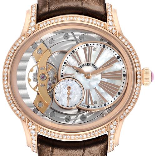 The image shows a face-on view of the Audemars Piguet Millenary 77247OR Women's Rose Gold Mother of Pearl Dial watch, featuring its intricately designed dial and visible mechanics.