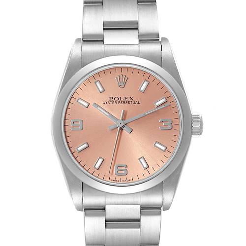 The image shows a front angle view of a Rolex Oyster Perpetual 77080 Women's Stainless Steel Brown Dial 77080 Women's Stainless Steel Brown Dial watch with a stainless steel bracelet and a salmon-pink dial.