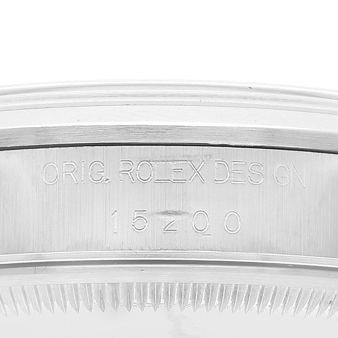 The image shows a close-up of the case body and bezel of the Rolex Date 15200 Men's Stainless Steel White Dial 15200 Men's Stainless Steel White Dial model, with engravings "ORIG. ROLEX DESIGN 15200".