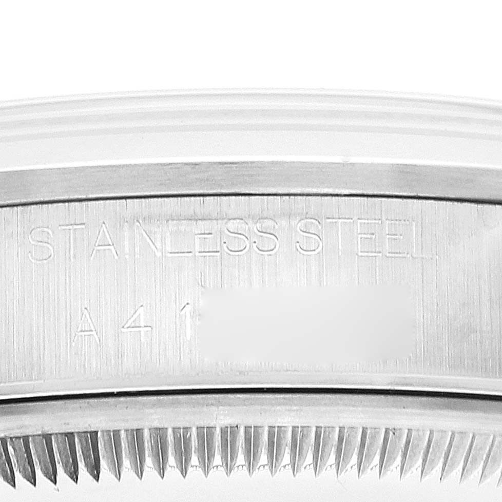 The image shows an angled close-up of the stainless steel case back part of a Rolex Date 15200 Men's Stainless Steel White Dial 15200 Men's Stainless Steel White Dial model watch.