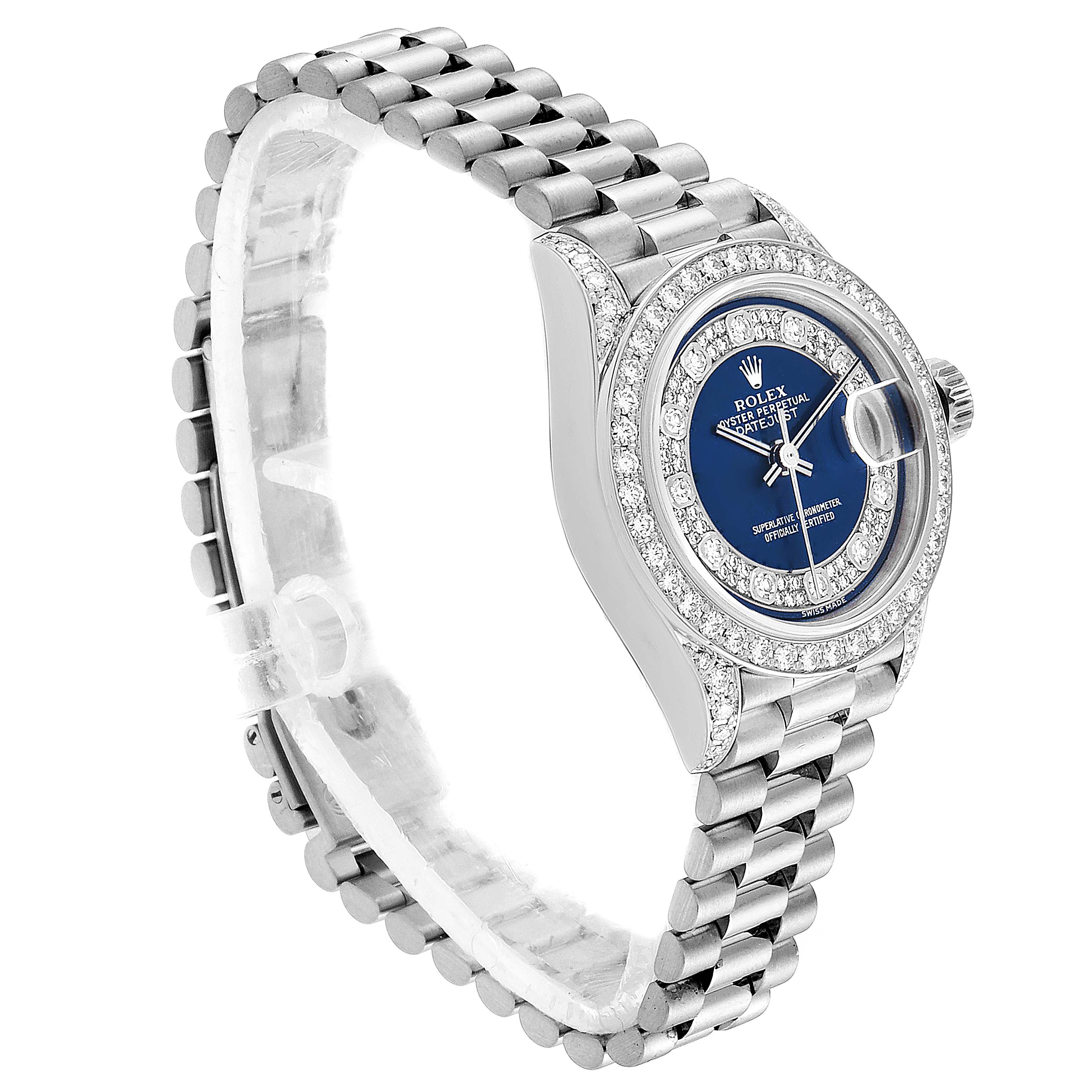 The Rolex President 79159 Women's White Gold Champagne Dial 79159 Women's White Gold Champagne Dial model watch shown is angled slightly from the front, displaying its blue dial, bejeweled bezel, and bracelet.