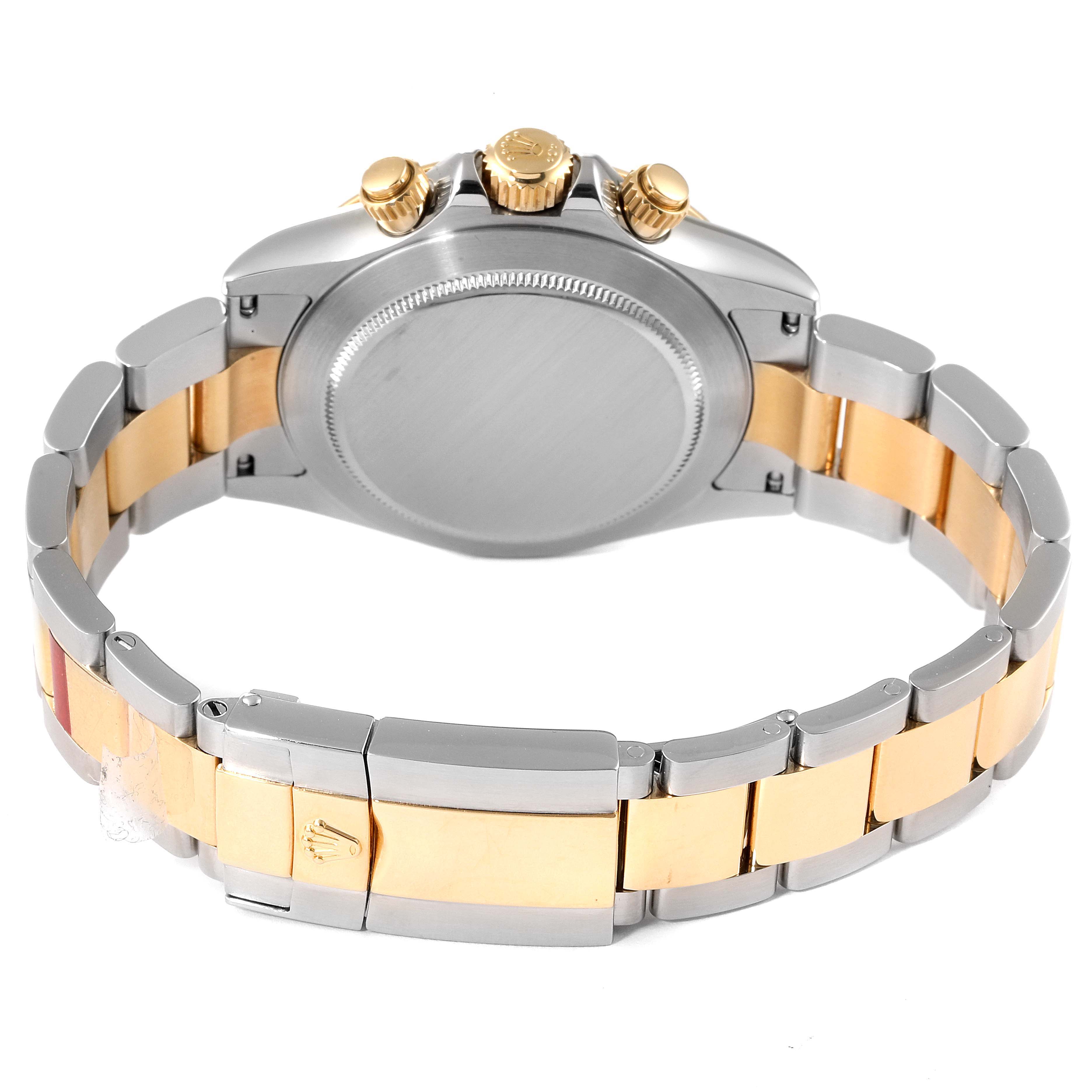 The back view of a Rolex Daytona 116523 Men's Steel and Gold (two tone) Mother of Pearl Dial 116523 Men's Steel and Gold (two tone) Mother of Pearl Dial watch displays its gold and steel bracelet, case back, and pushers.