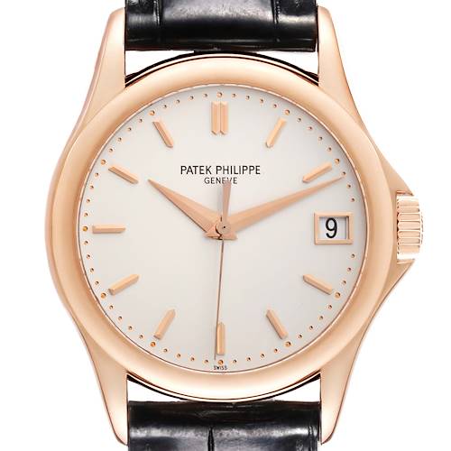 The Patek Philippe Calatrava 5127R-001 Men's Rose Gold Silver Dial 5127R-001 Men's Rose Gold Silver Dial watch is shown from a front angle, displaying its face, hands, date, and crown.