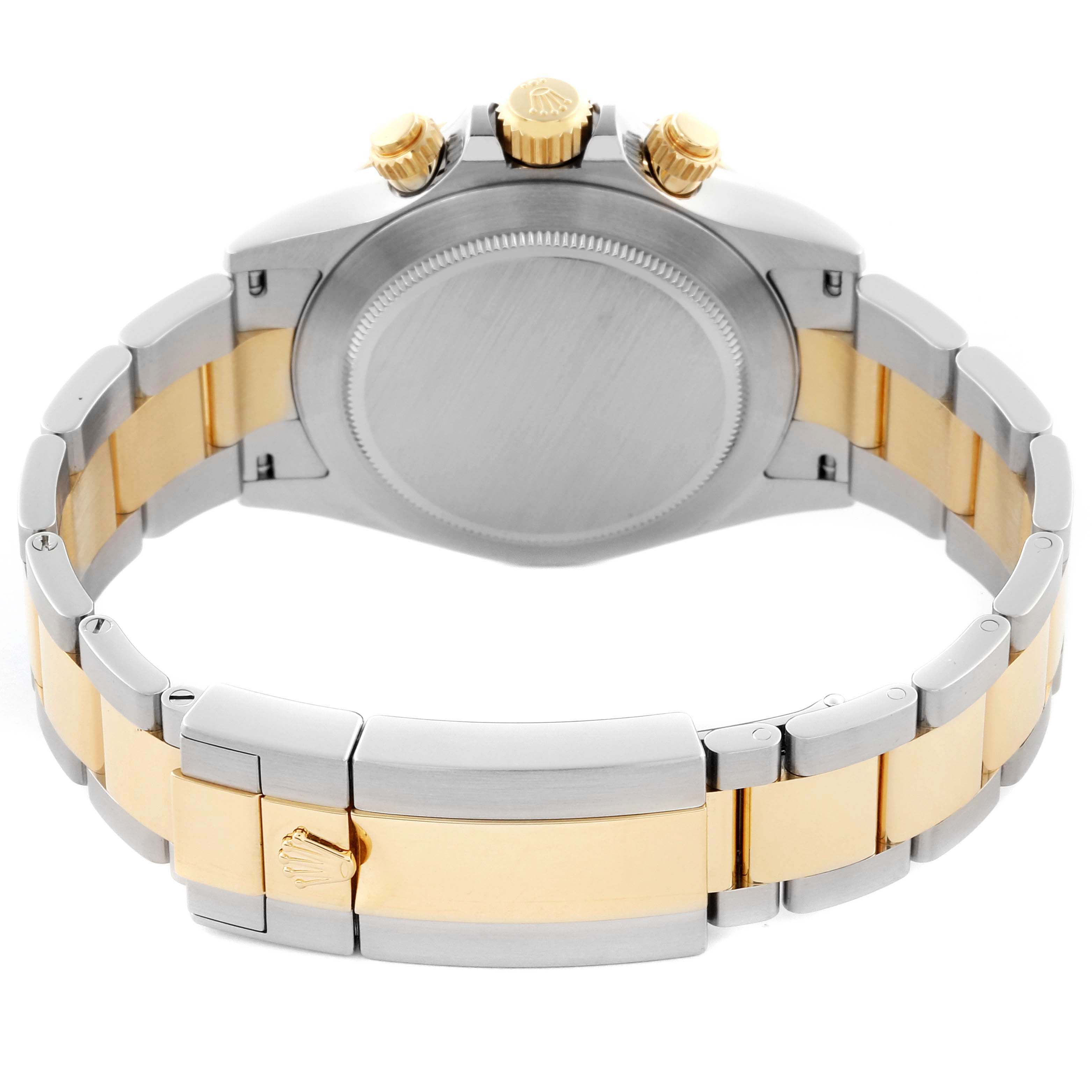 The Rolex Daytona 116523 Men's Steel and Gold (two tone) Silver Dial 116523 Men's Steel and Gold (two tone) Silver Dial watch is shown from the back, highlighting the case back, bracelet, and clasp.