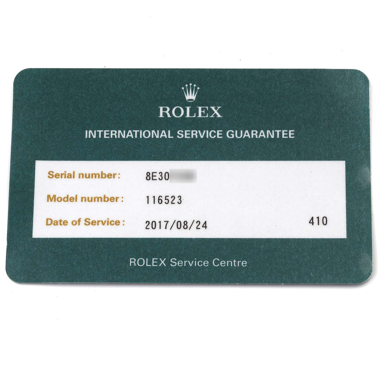 The image shows a Rolex International Service Guarantee card for the Daytona model 116523.